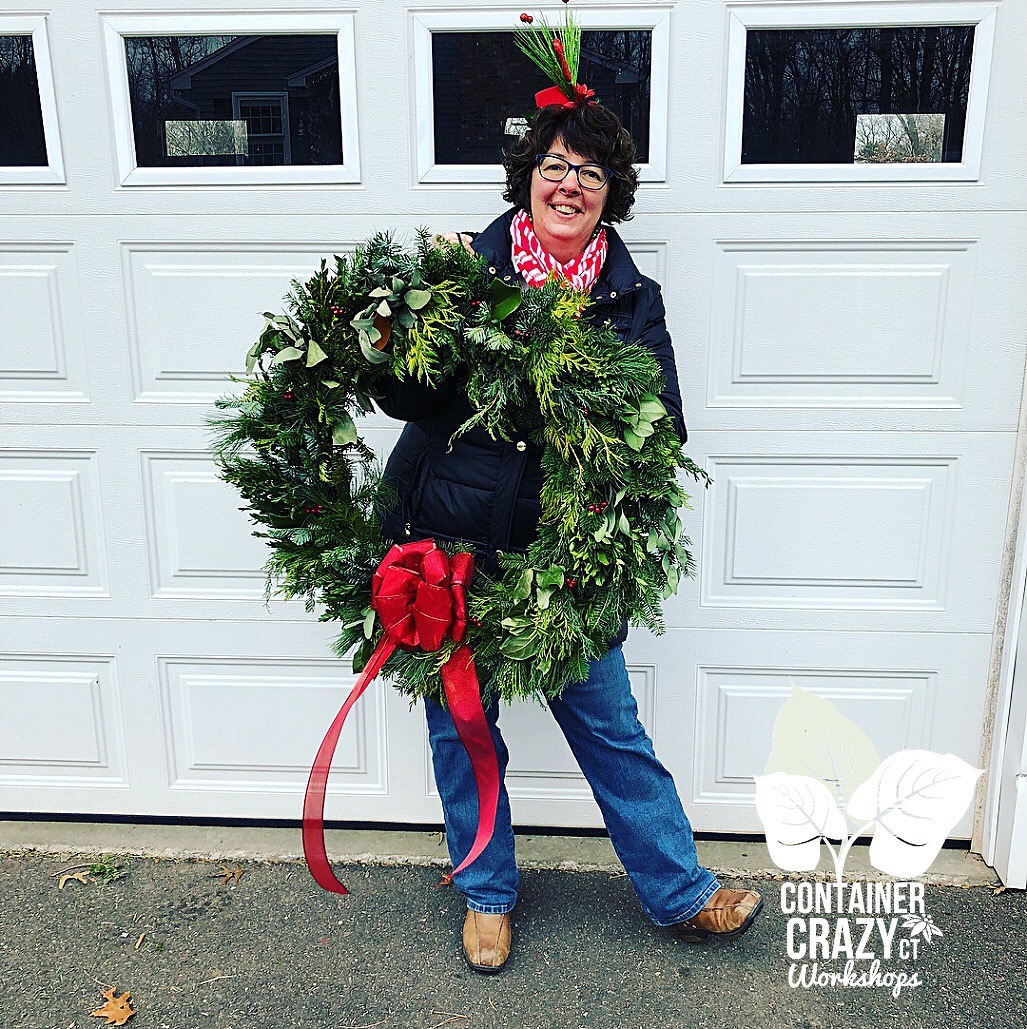 Cathy T Holding Large Wreath